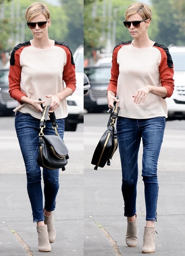 Charlize Theron was dressed in her casual jeans paired with a chic color-blocked top and stylish ankle booties