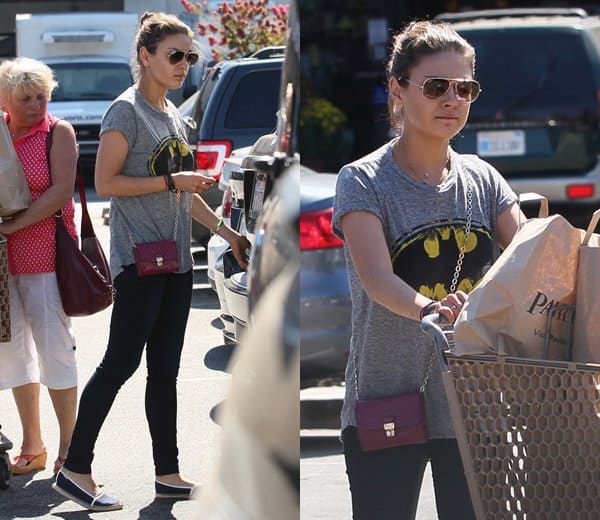 Mila Kunis shopping at Pavilions supermarket with Tod's crossbody bag and a Batman T-shirt