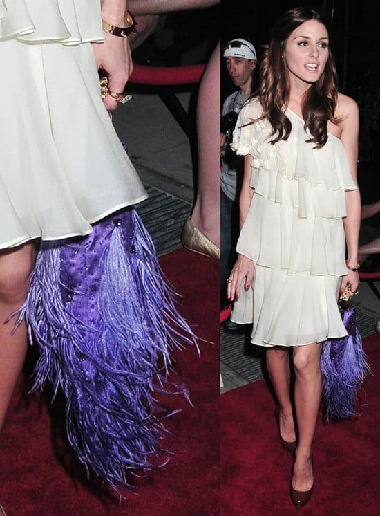 Olivia Palermo walks the red carpet with a purple feather-embellished purse at the 2010 Operation Smile annual gala at Cipriani, Wall Street in NYC on May 6, 2010