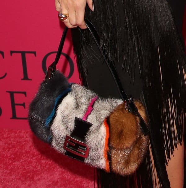 Olivia Palermo toting Fendi's mink and fox fur baguette bag