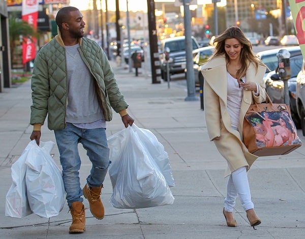 Couple Kim Kardashian and Kanye West out doing some shopping at a sporting goods store in Los Angeles, California on December 26, 2013