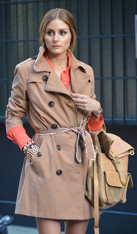Olivia Palermo carries a khaki backpack in New York City