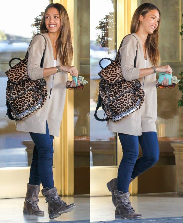 Jessica Alba in jeans and an Inhabit boiled wool cardigan arrives at the Sunset Tower Hotel in West Hollywood