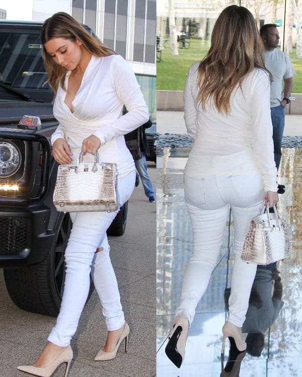 Kim Kardashian in an all-white outfit as she visited an office