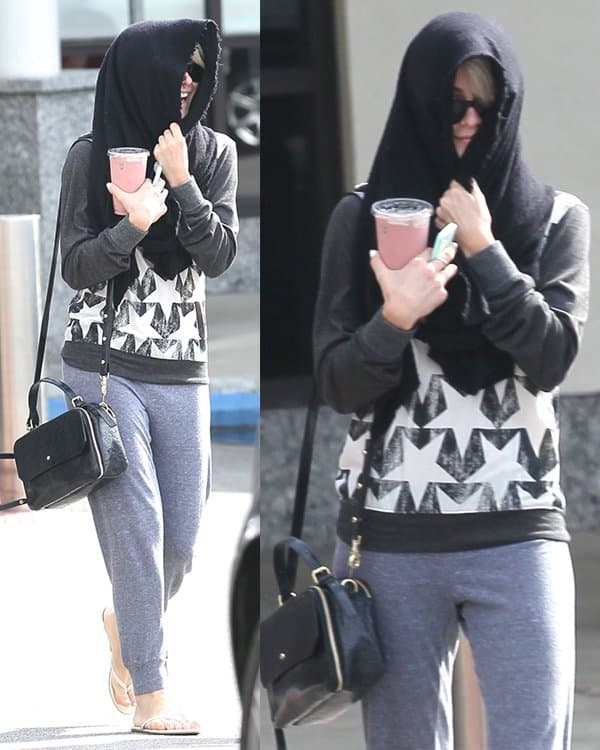Julianne Hough wears a star-printed sweater with jogging pants