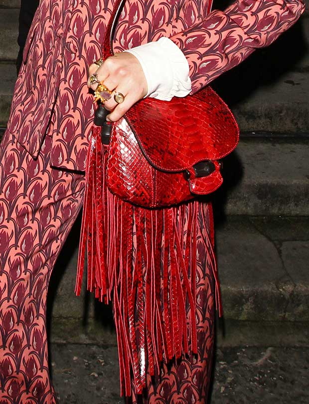 Florence Welch toting a Gucci fringed python bag