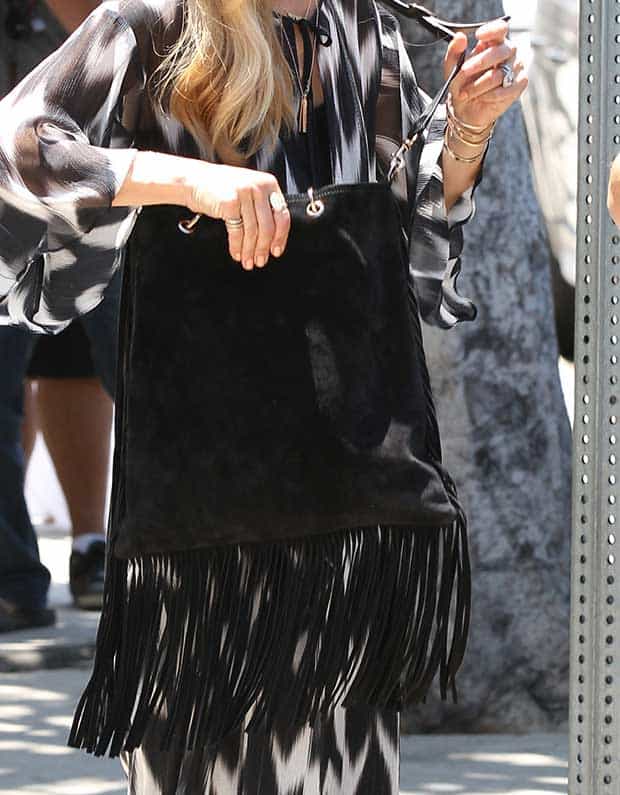 Rachel Zoe carrying a Gucci fringe shopper