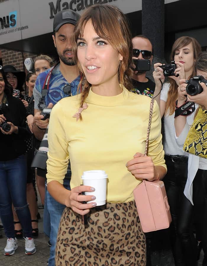 Alexa Chung carries a bag from Chanel's Supermarket Collection