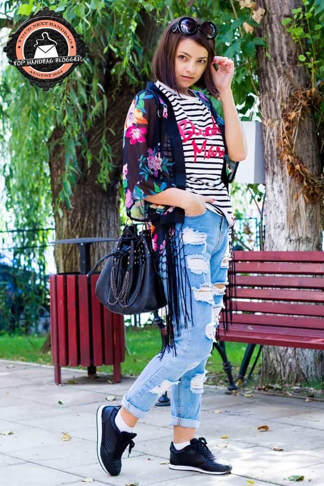 Kristina styles boyfriend jeans with a striped shirt, a kimono, and Nike shoes