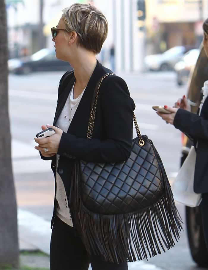 Kaley Cuoco totes a quilted leather fringe bag from Chanel's Métiers d'Art show, dubbed Back in Dallas