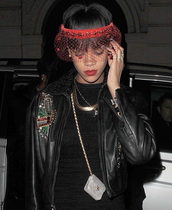 Rihanna with a super tiny Chanel purse slung over her shoulder