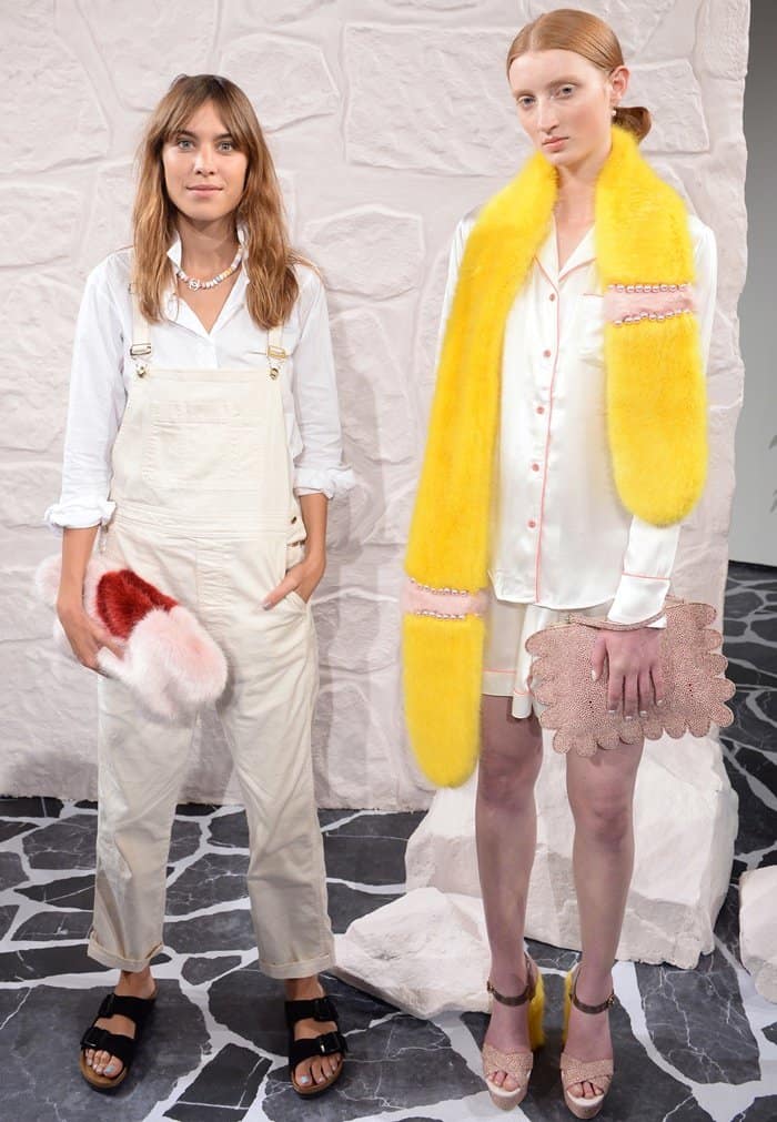 Alexa Chung with a model at the Shrimps runway show during London Fashion Week