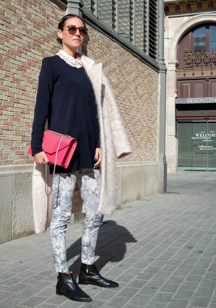 Isabella Pozzi rocks snake print pants with a bright pink purse