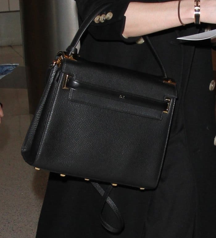 Dakota Johnson totes her personalized Valentino My Rockstud bag