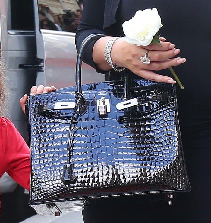 Mariah Carey was carrying a 30cm Hermes Black Birkin with a glossy crocodile leather finish.