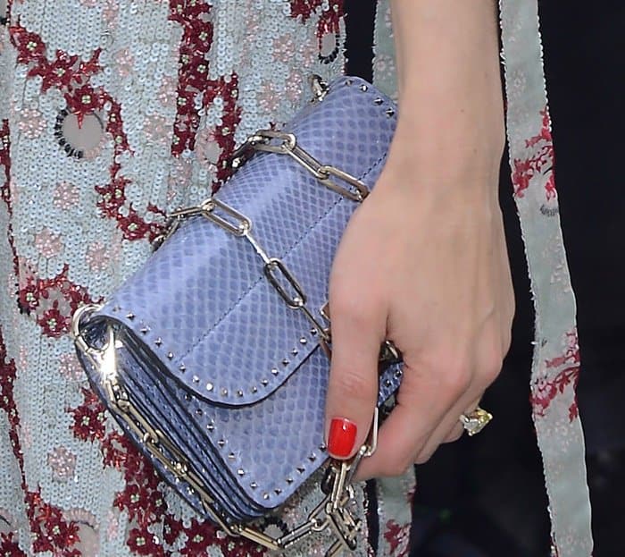 Olivia Palermo carrying a Valentino purse during Paris Fashion Week.