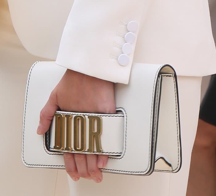 Gemma Arterton attends Paris Fashion Week with a Dior Flap Clutch.