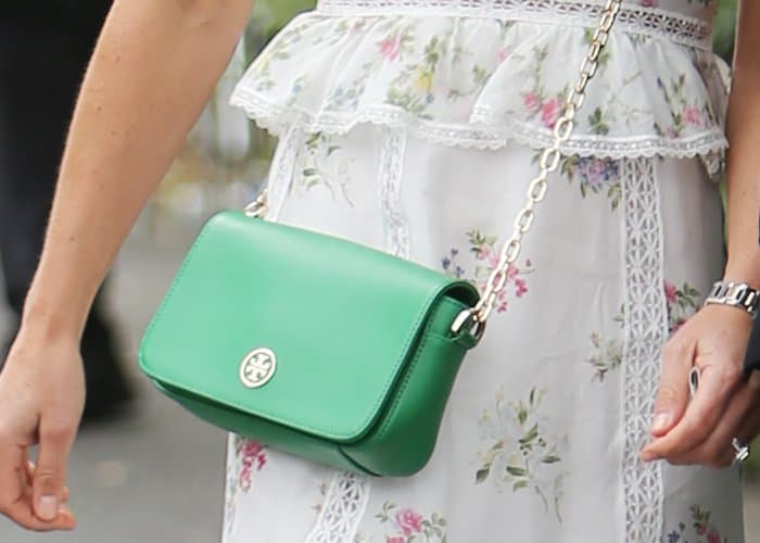 Gleaming hardware make Pippa Middleton's green leather wallet from Tory Burch as beautiful as it is versatile