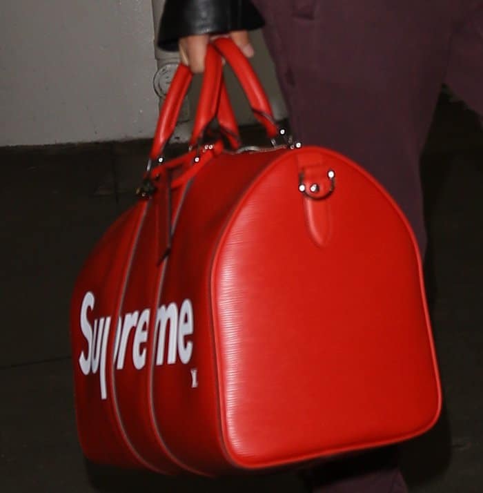 Hailey Baldwin carried a KeepAll tote from the popular Louis Vuitton x Supreme collaboration