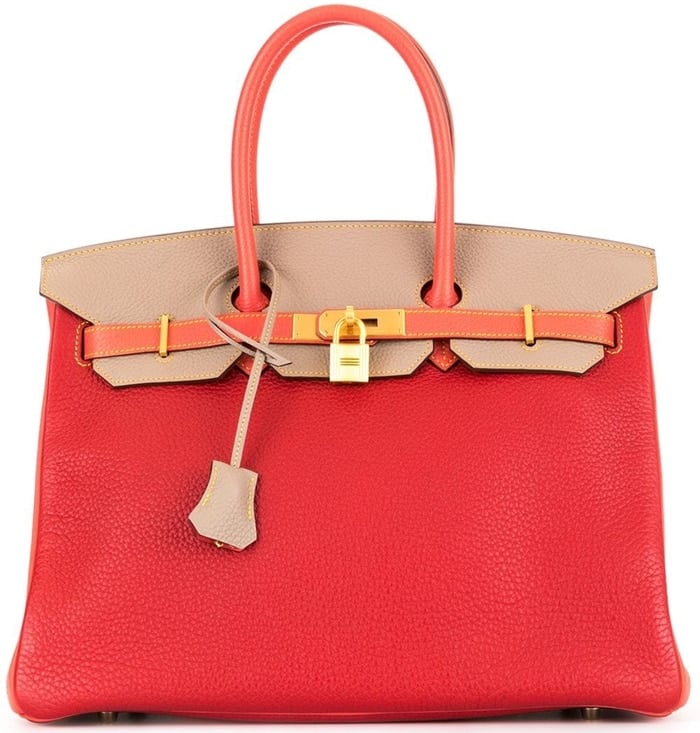 Crafted from coral red and khaki beige leather, this Hermès Birkin bag has the classic thin sangles with a frontal twist-lock fastening