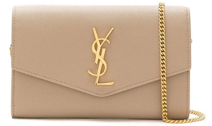The Uptown Envelope pouch offers refined elegance, with the signature YSL logo plaque and chain-link shoulder strap