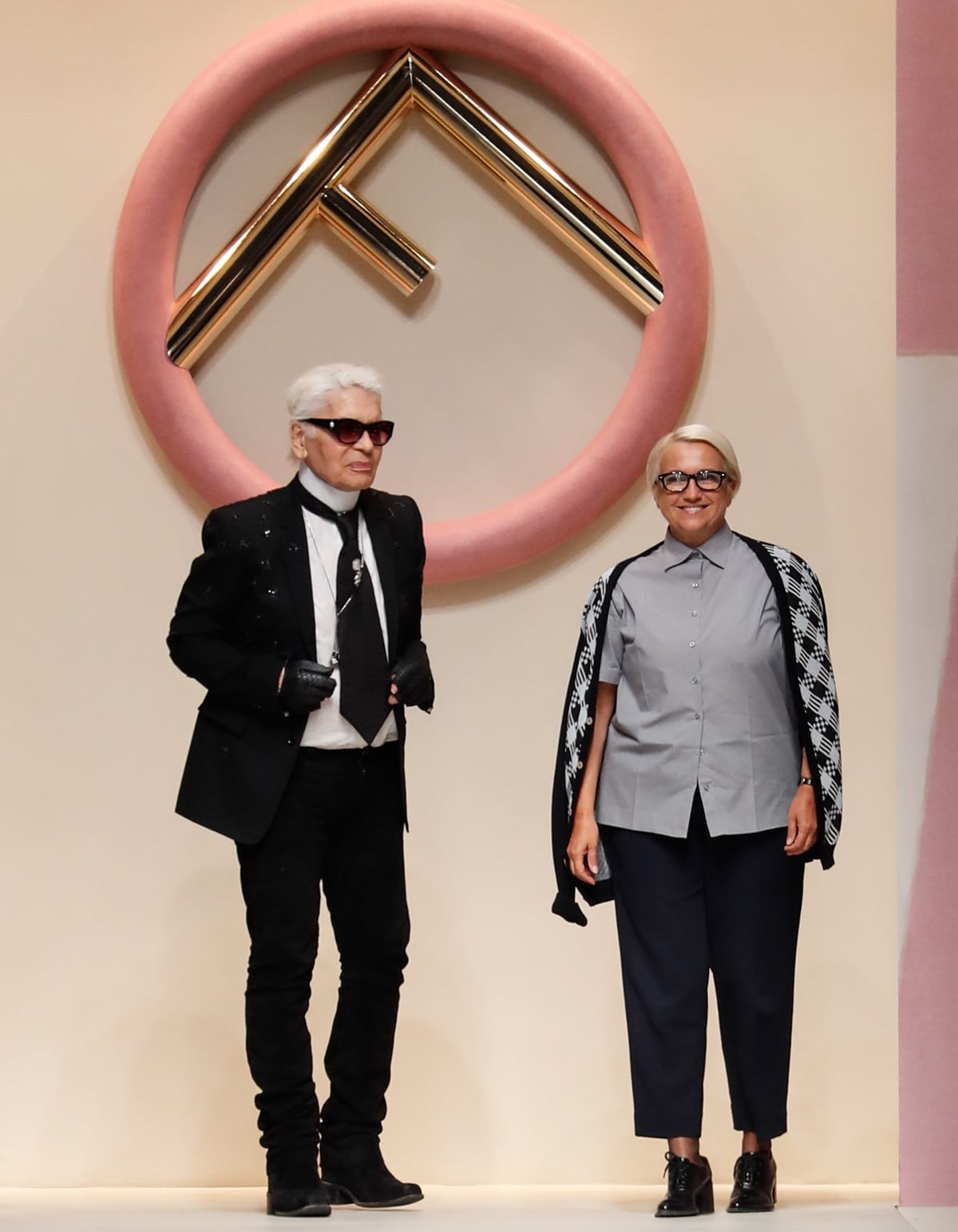 Silvia Venturini Fendi (R), who introduced the Fendi Baguette bag in 1997, with her friend Karl Lagerfeld at the Fendi show
