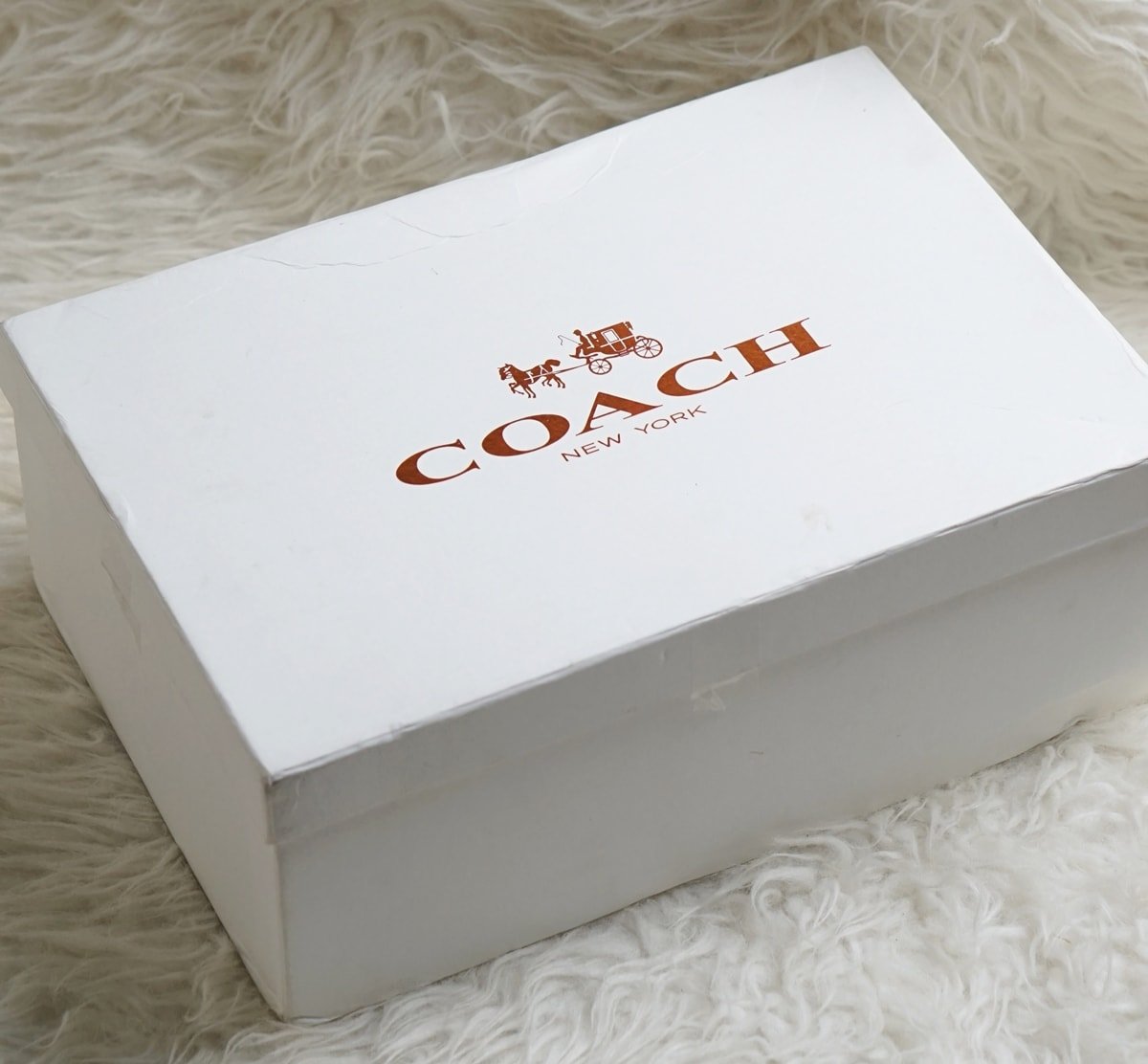 White Coach gift box with the iconic horse and carriage logo