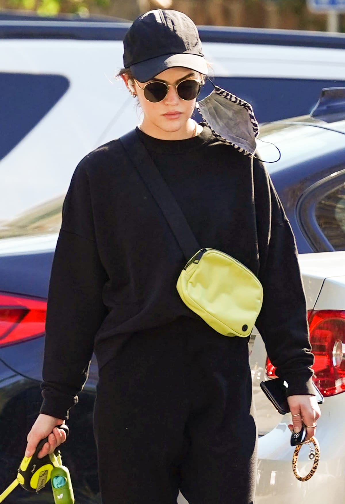 Lucy Hale shows how to wear a yellow Lululemon Everywhere belt bag